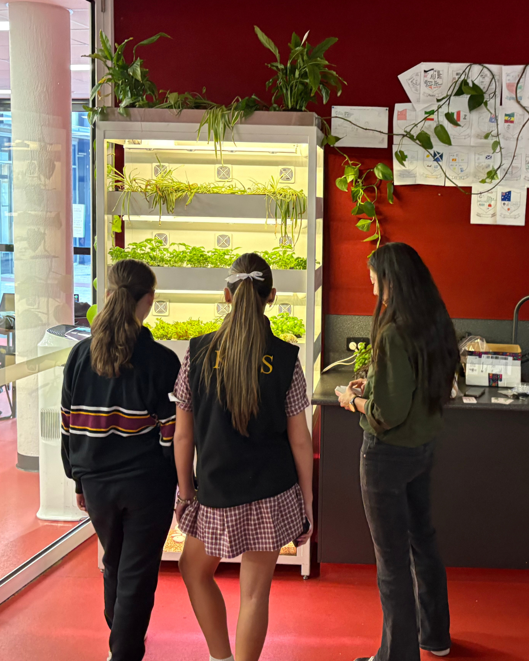 Students and teacher exploring a Farmwall unit